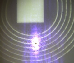 Micrograph of a spiral resonator structure with an optical response at its centre